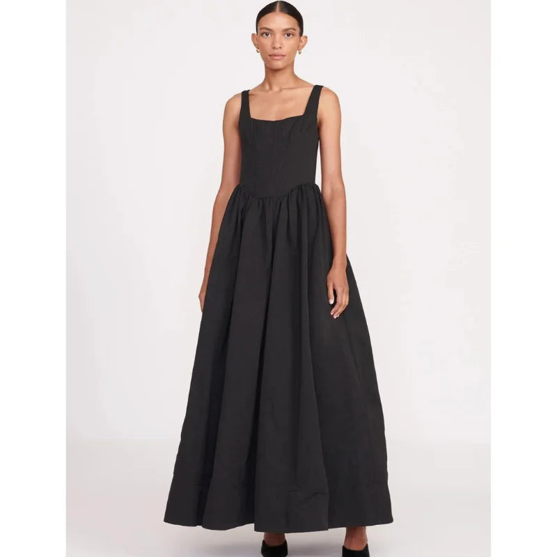 Black square neckline midi dress in sleeveless design by Devon. Features elegant silhouette and versatile style for any…
