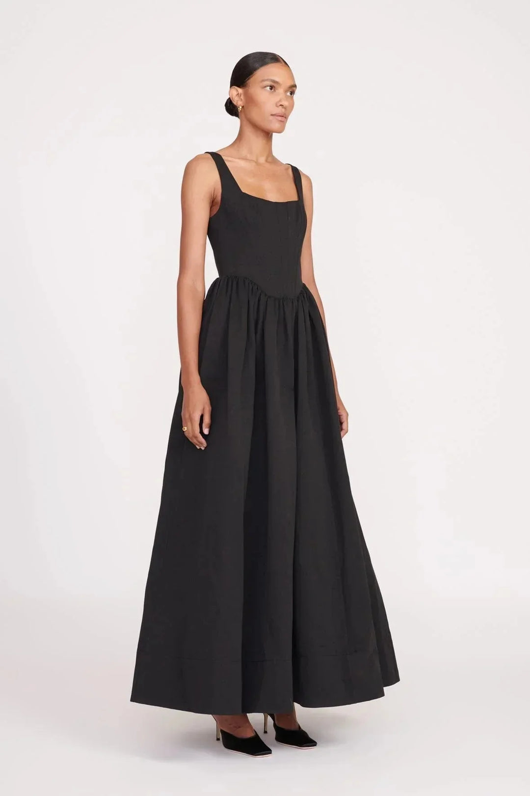 Sleeveless black midi dress with square neckline, perfect for chic casual days.