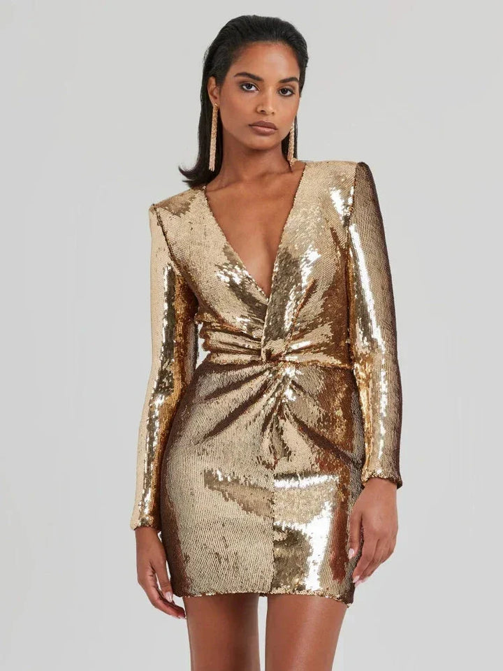 Gold sequined mini dress with long sleeves, perfect for a glamorous night out or formal event.