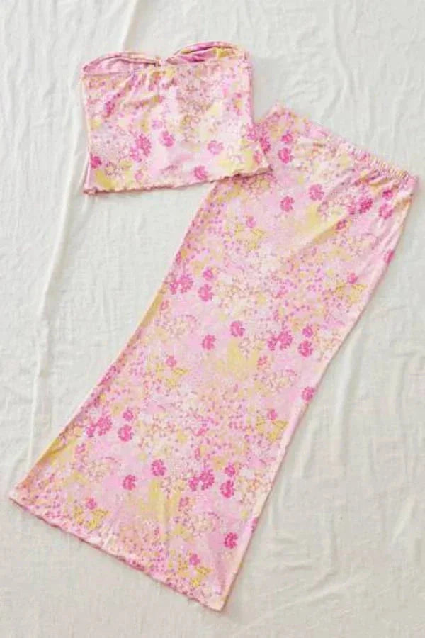 Pink floral cut-out maxi outfit featuring a delicate design with intricate cut-out details, perfect for a chic and feminine…