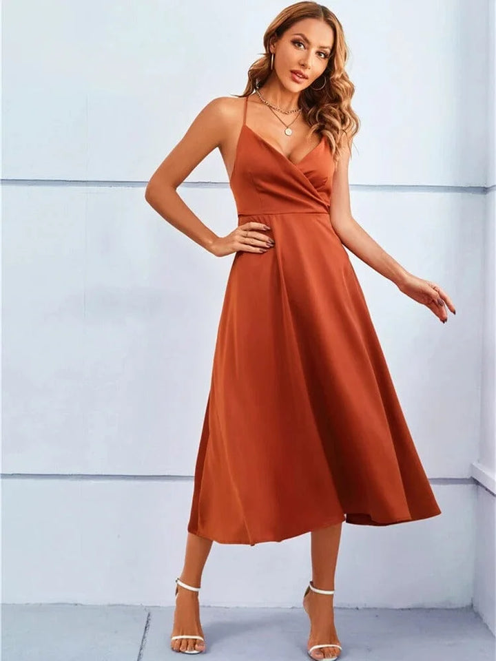 "Sleeveless silk midi dress with adjustable straps in Dolores design, perfect for casual or formal occasions."