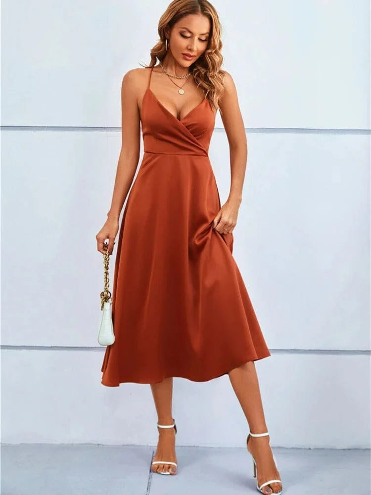 Sleeveless silk midi dress with adjustable straps in soft lavender, perfect for summertime outings.