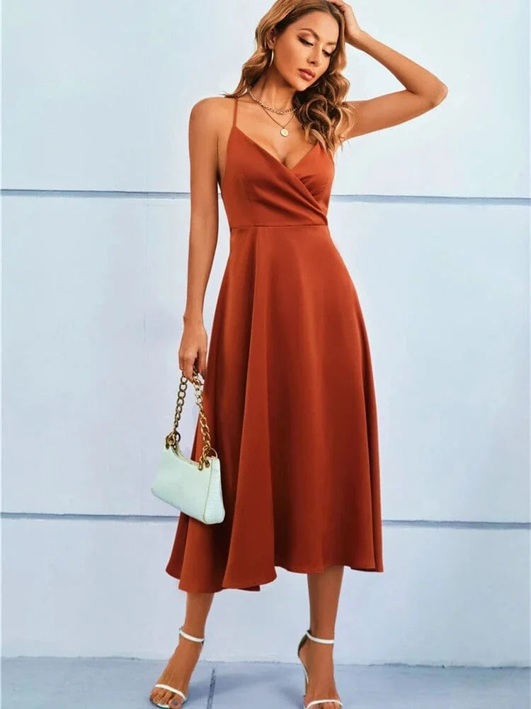 Maroon silk midi dress with adjustable straps and sleeveless design.
