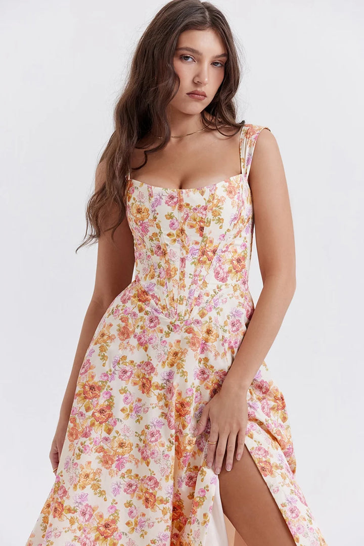 Floral midi dress with shapely seams, made of lightweight fabric, features a flattering design for a dreamy look.