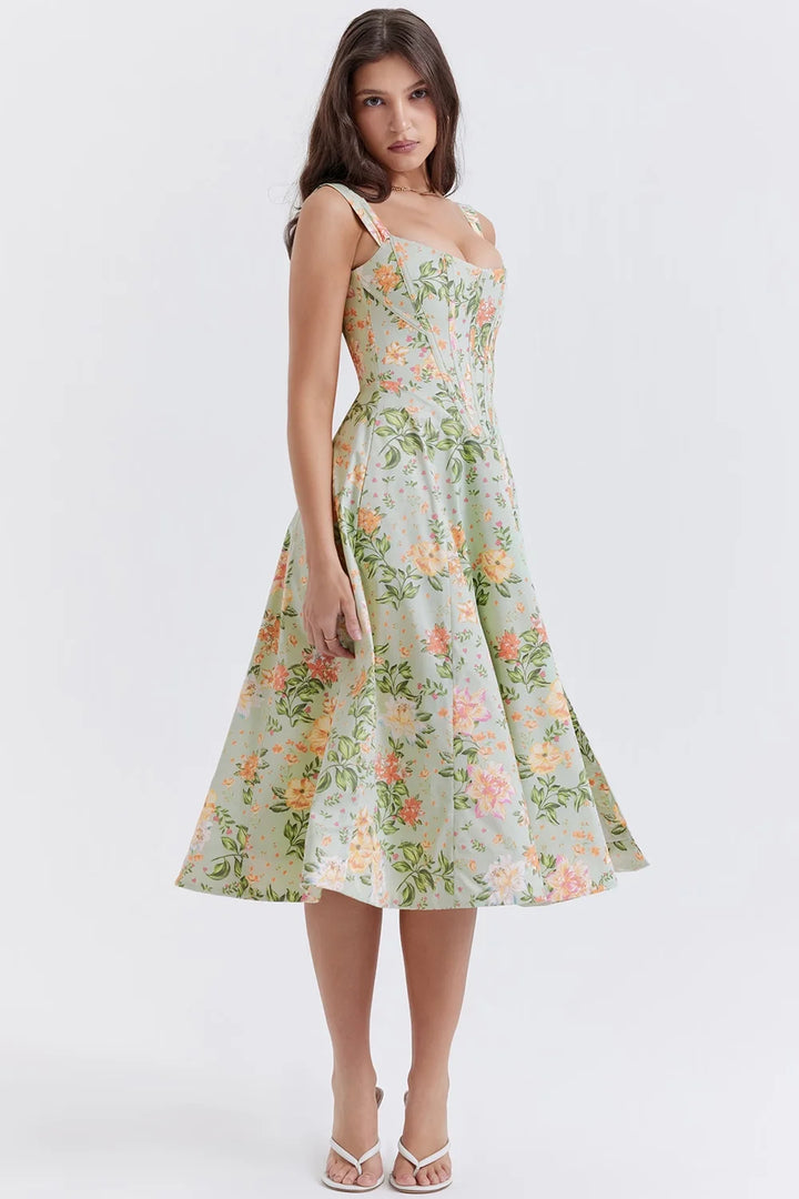 Floral midi dress with shapely seams, made from lightweight, flowy fabric for a flattering silhouette.