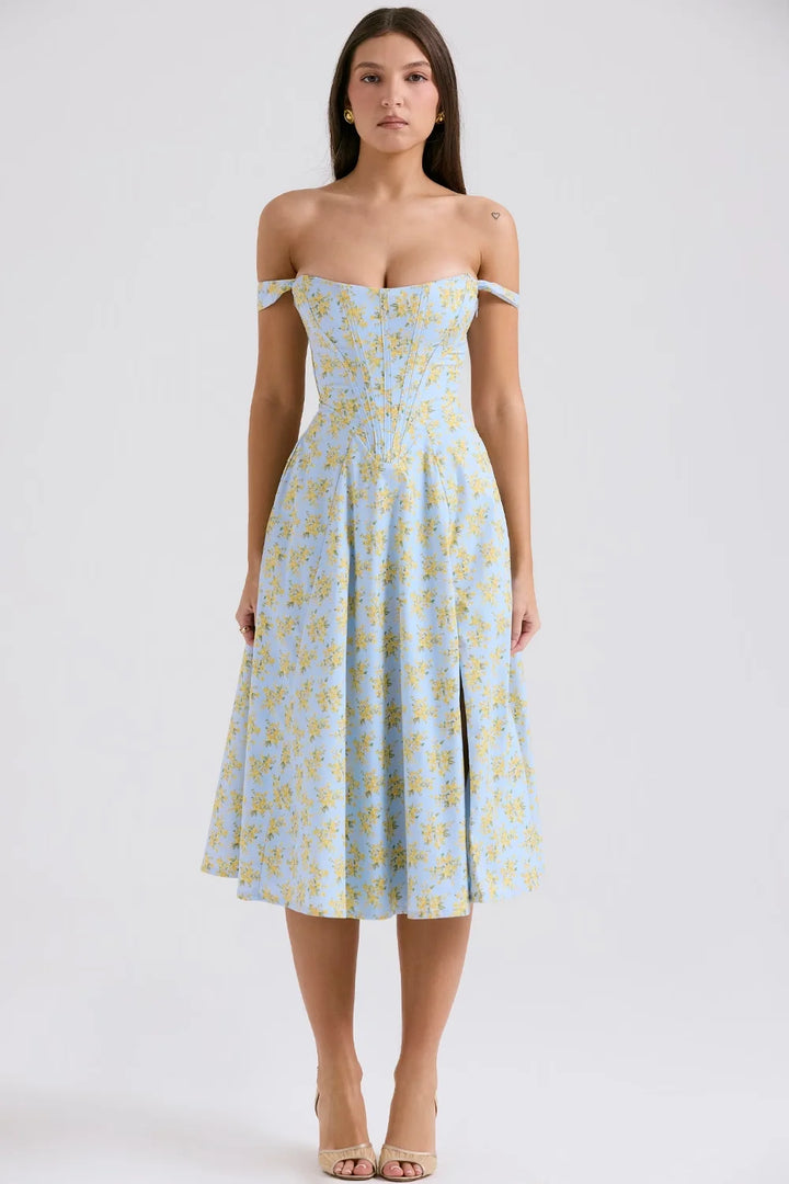 Blue floral midi dress with shapely seams, perfect for any occasion. Made from high-quality fabric with a flattering fit.