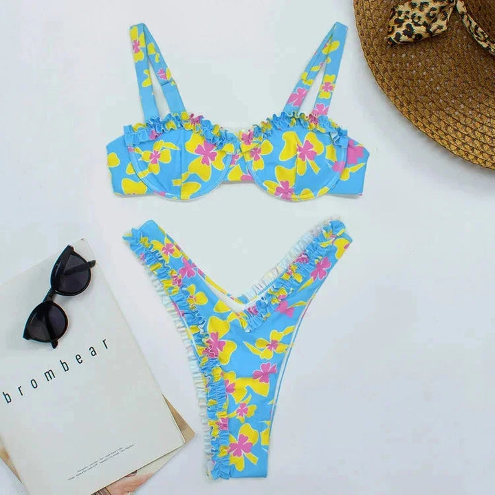 Women's ruffled bikini set in light blue with matching bottoms, featuring a playful and feminine design perfect for the…