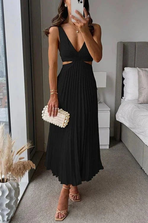 Black pleated midi dress with cut-out accents by Easton. Made of soft and flowy fabric, perfect for a sophisticated look.