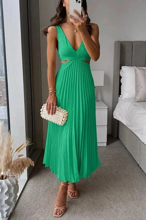 Green pleated midi dress with cut-out accents by Easton, perfect aesthetic for summer events or casual gatherings.