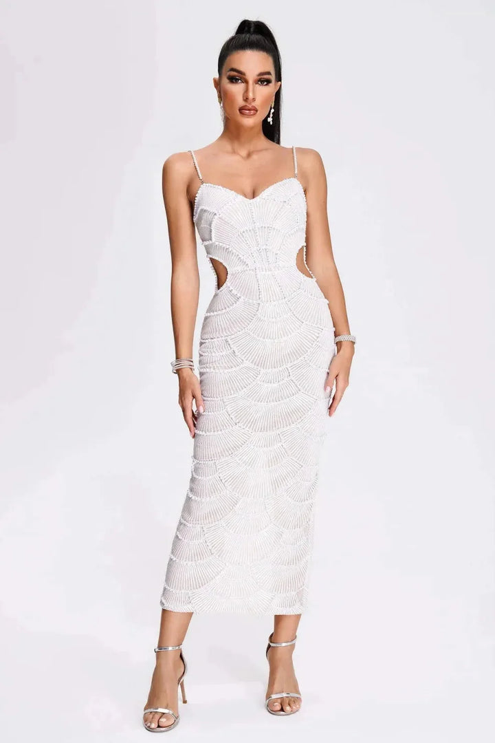 White sequined midi dress with straps, perfect for special occasions. Glamorous sequin detailing and adjustable straps for a…