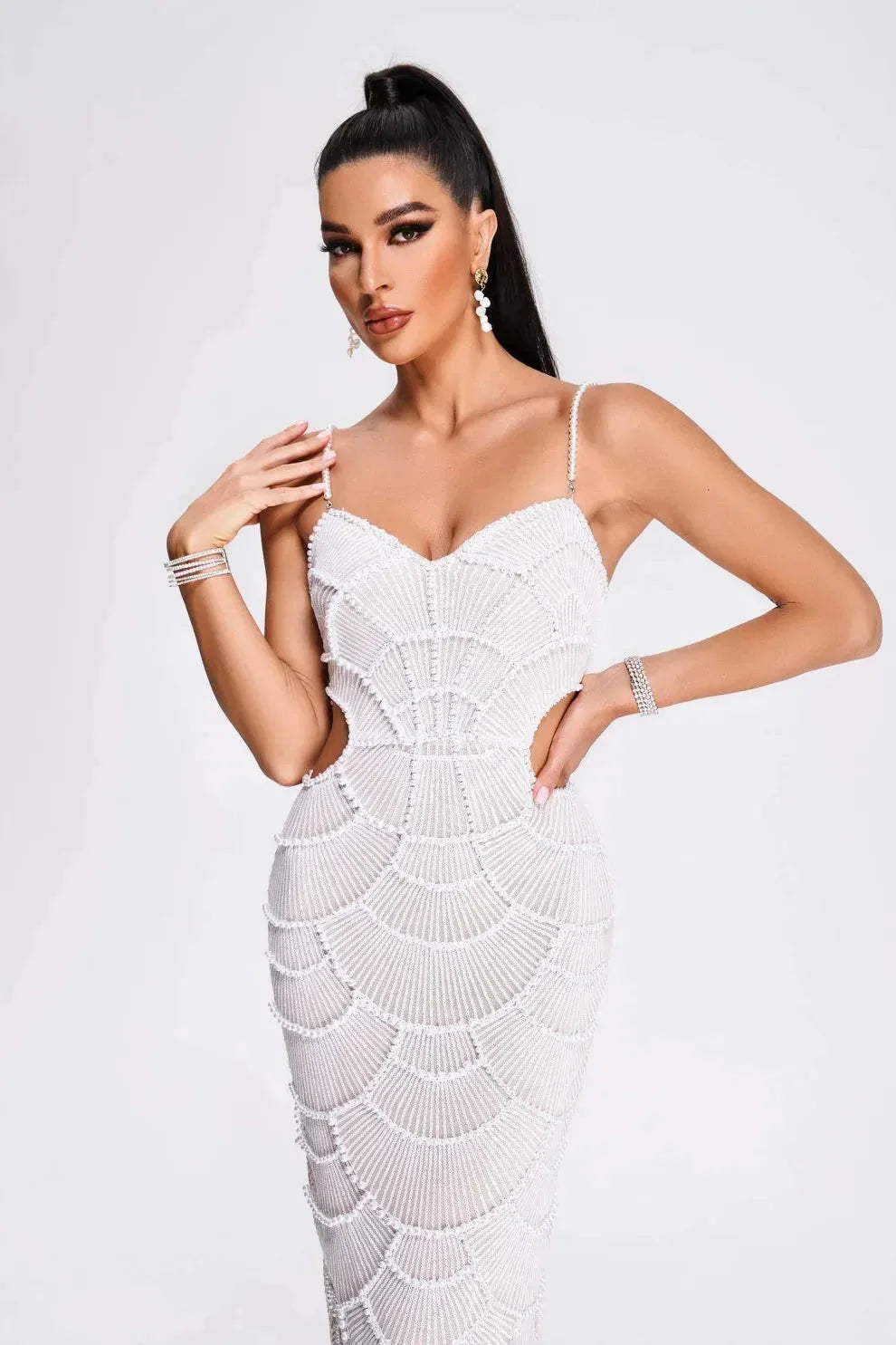 White sequined midi dress with spaghetti straps for women, perfect for special occasions.