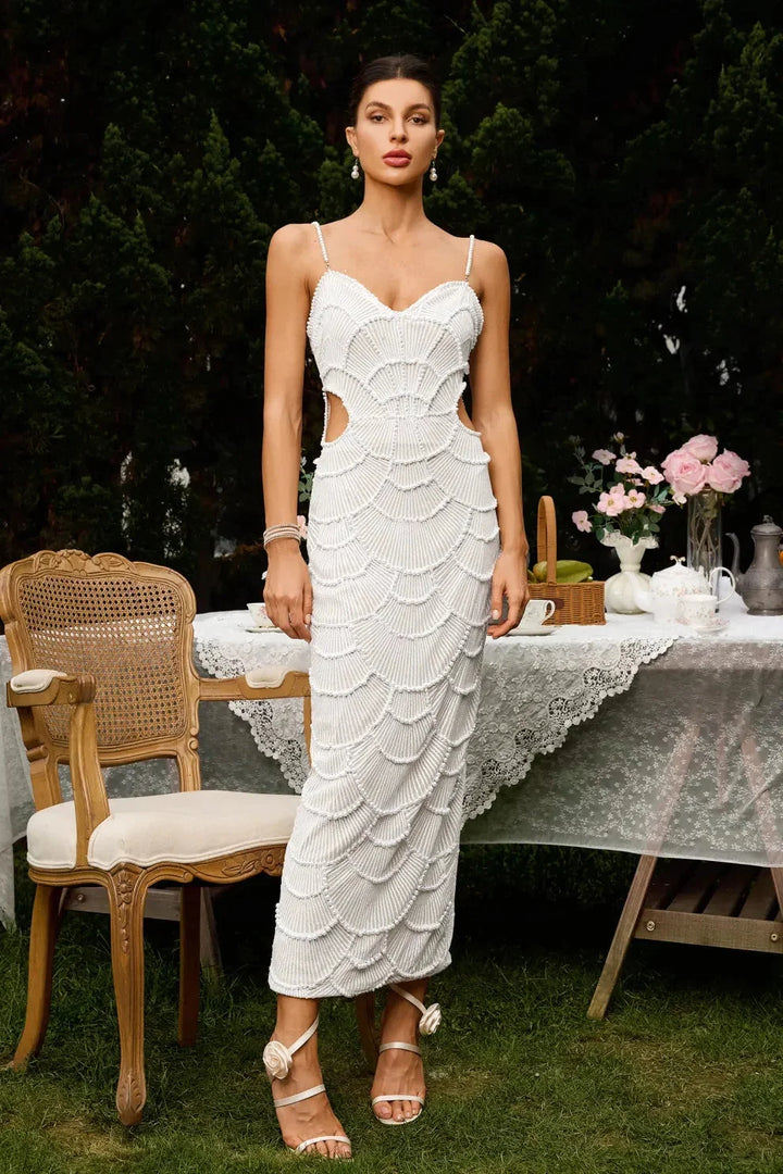 White sequined midi dress with straps for women. Elegant design perfect for special occasions.