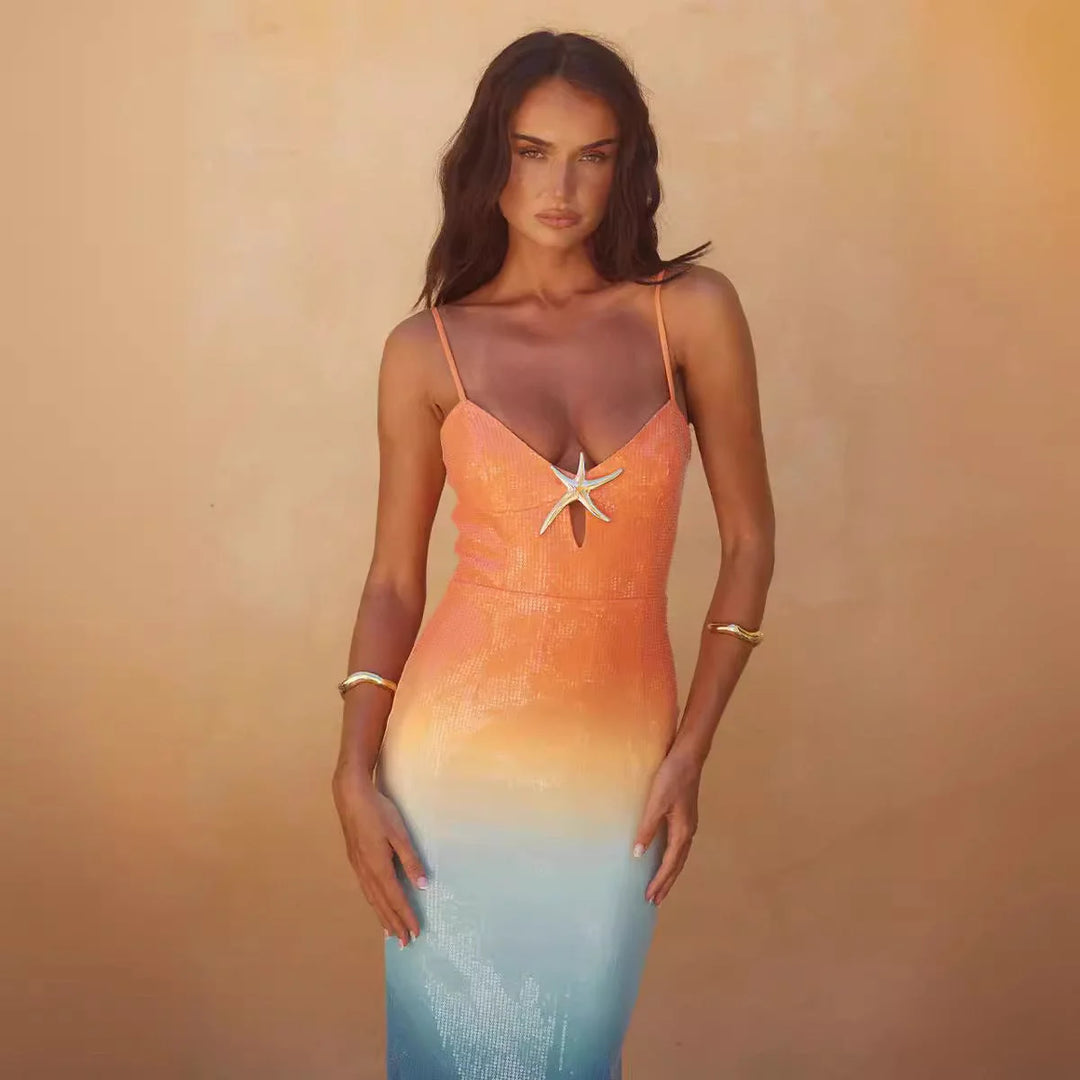 "Sunset ombre midi dress with starfish design, made of lightweight flowing fabric for a beachy, boho look."