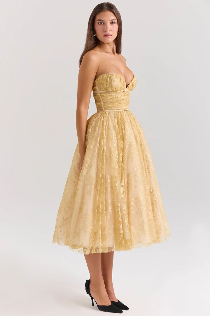 Strapless mid-length dress with golden floral pattern, perfect for an elegant occasion.