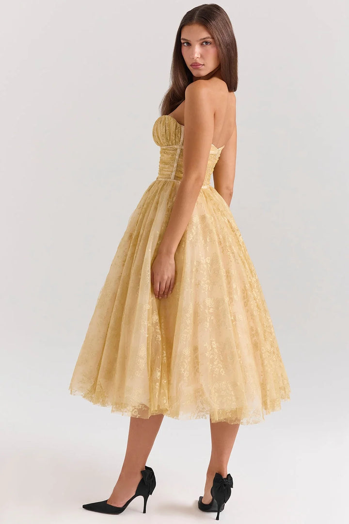 Strapless golden floral mid-length dress featuring an elegant design with intricate floral pattern, perfect for special…