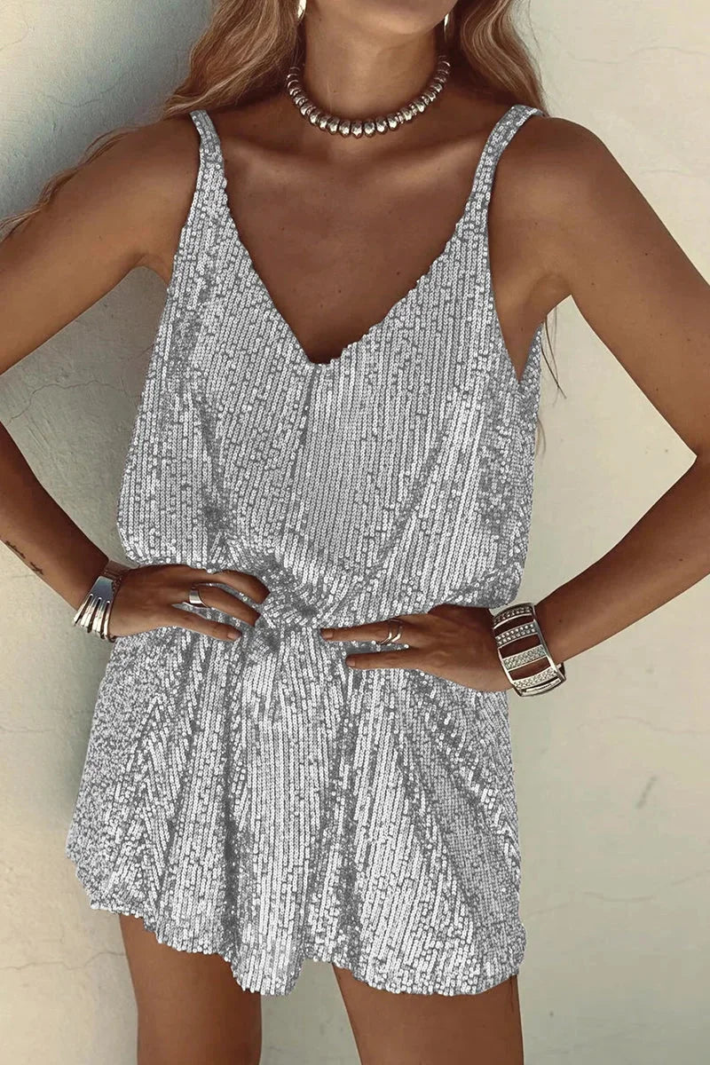 "Black sequin romper with plunging V-neck and sleeveless design, perfect for night outs and special occasions."