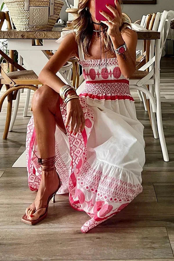 White maxi dress with pink tribal patterns, perfect for summer with a flowing silhouette and spaghetti straps, made of…