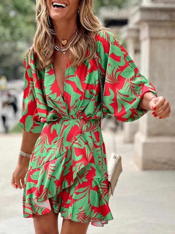 Red tropical print dress with flared sleeves, perfect for summer outings. Vibrant color and lightweight fabric make a…