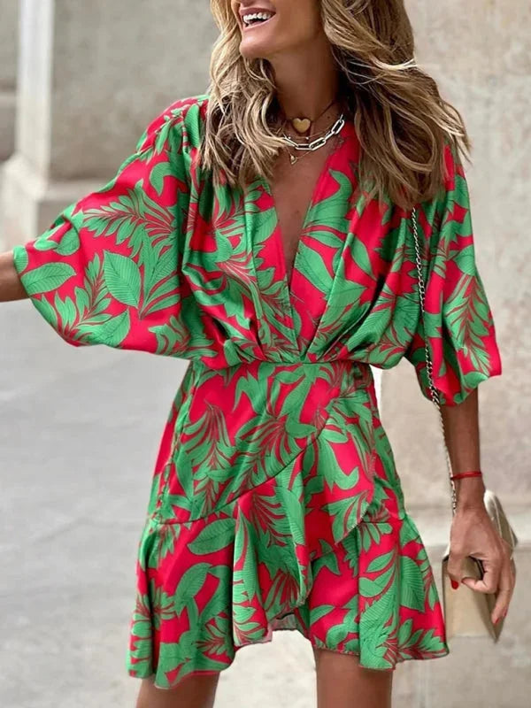 Red tropical print dress with flared sleeves, perfect for summer. Vibrant colors and flowy fabric make a bold, chic…