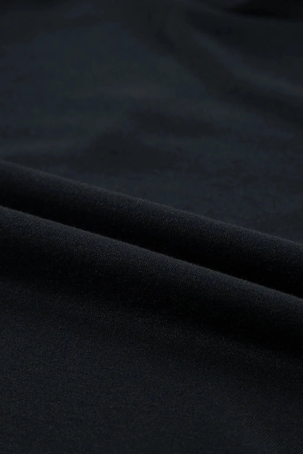 Black mini dress with ruffle sleeves in a stretchy, comfortable polyester blend fabric. Chic and feminine design for a…