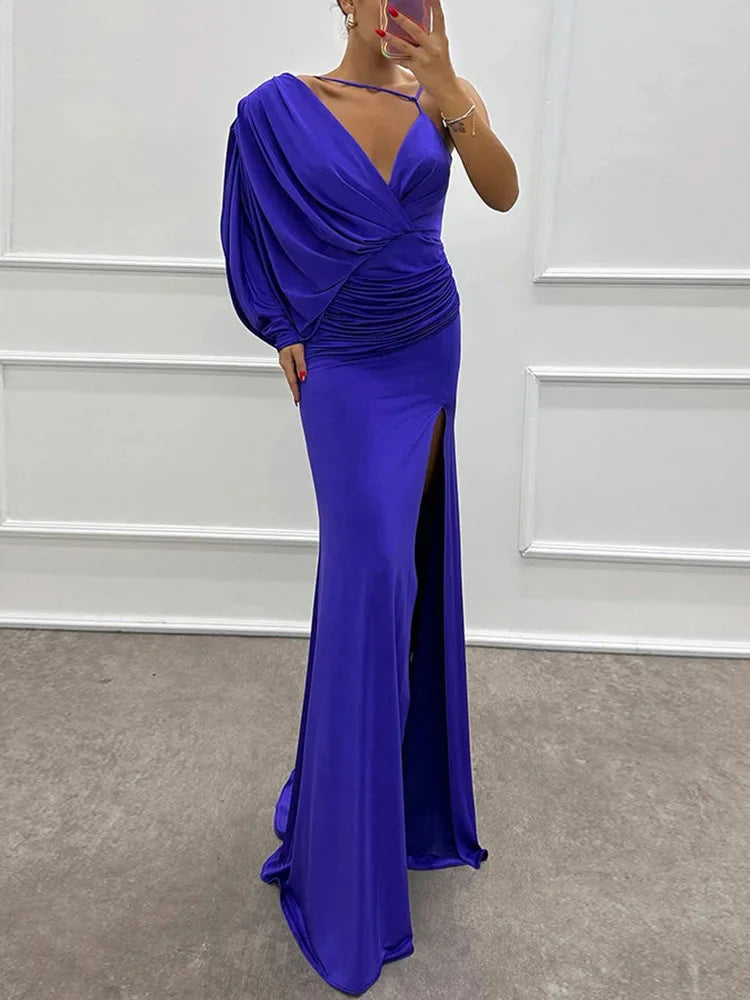 One-shoulder sleek long dress with side slit in soft jersey fabric in black color.