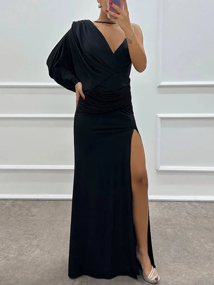 Black one-shoulder dress with side slit, made with sleek, figure-hugging fabric, perfect for a bold and elegant look.