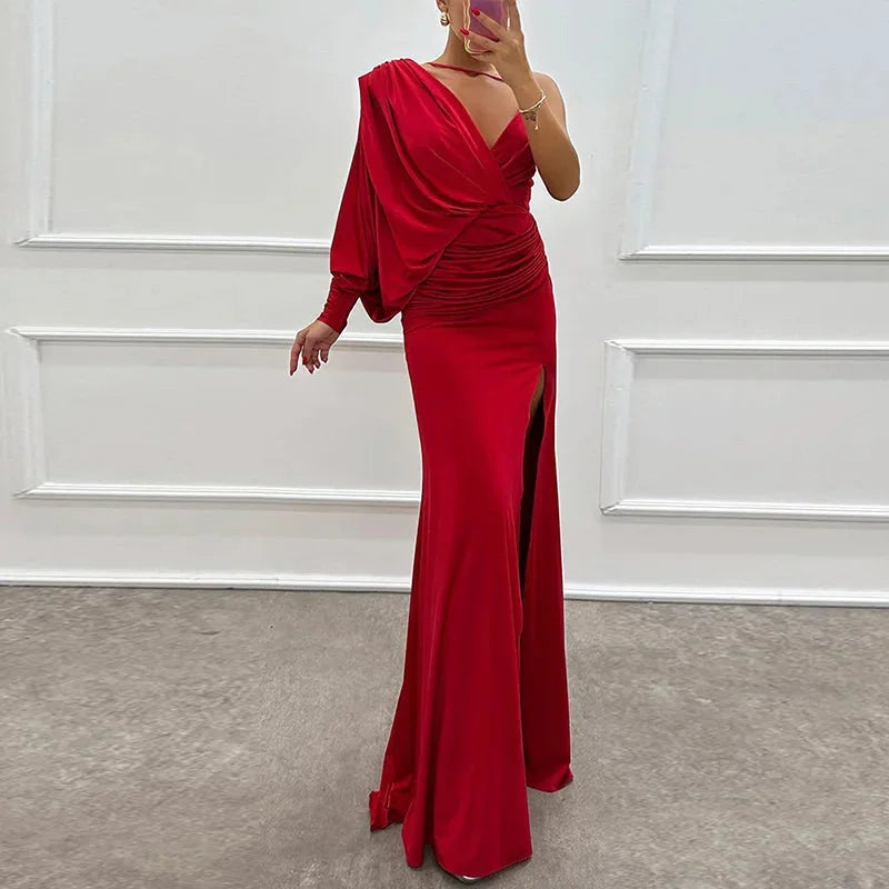 Red one-shoulder dress with side slit, made of sleek and soft fabric.