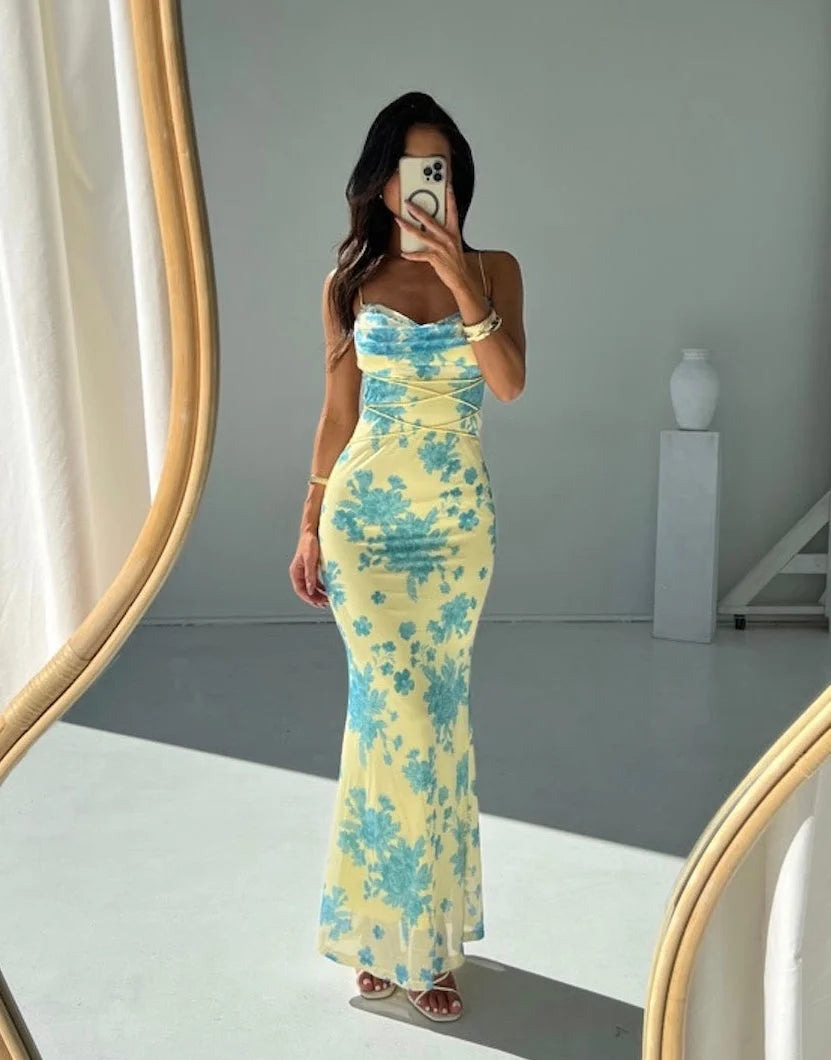 "Sleeveless yellow maxi dress with slim fit silhouette, ideal for a casual yet stylish look."
