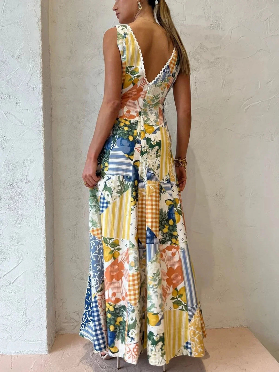 Sleeveless maxi dress in patchwork design, made with lightweight and breathable fabric in earthy tones.