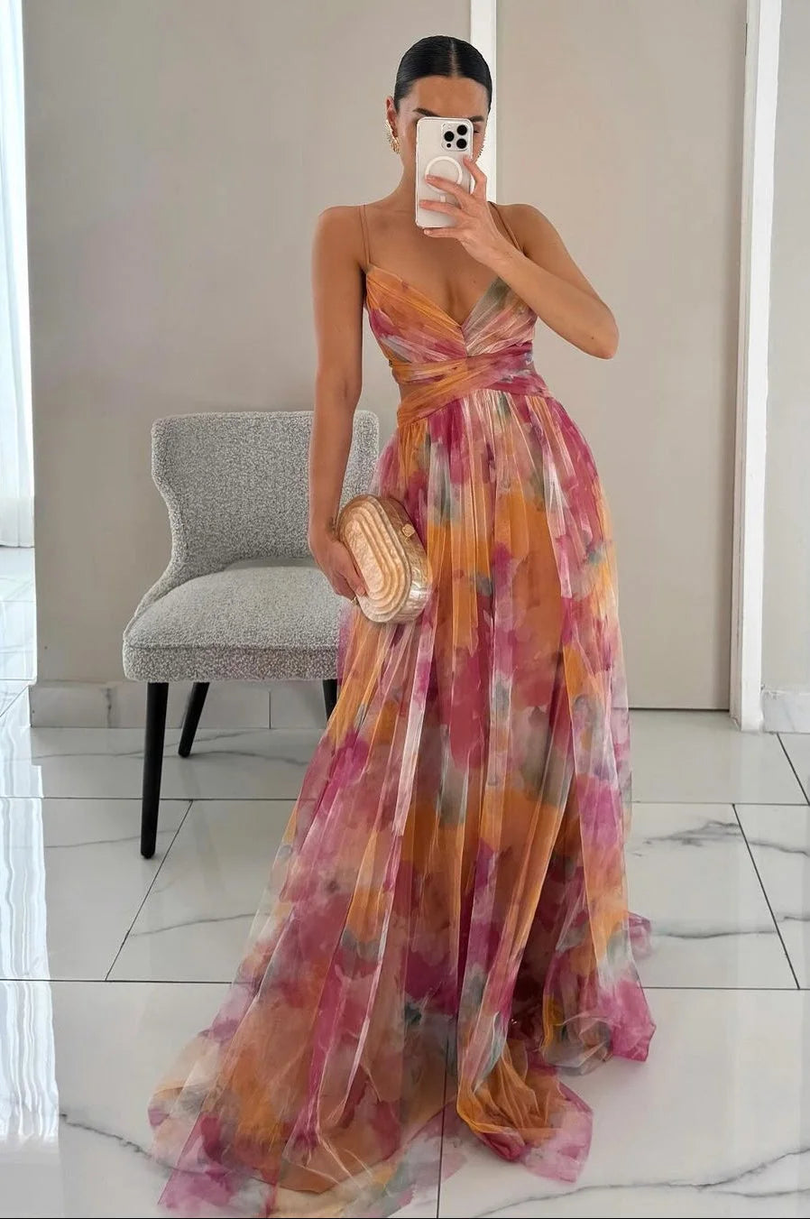 Orange textured maxi dress with tiered layers, adding flowy elegance. Perfect for a chic and stylish look at any event or…