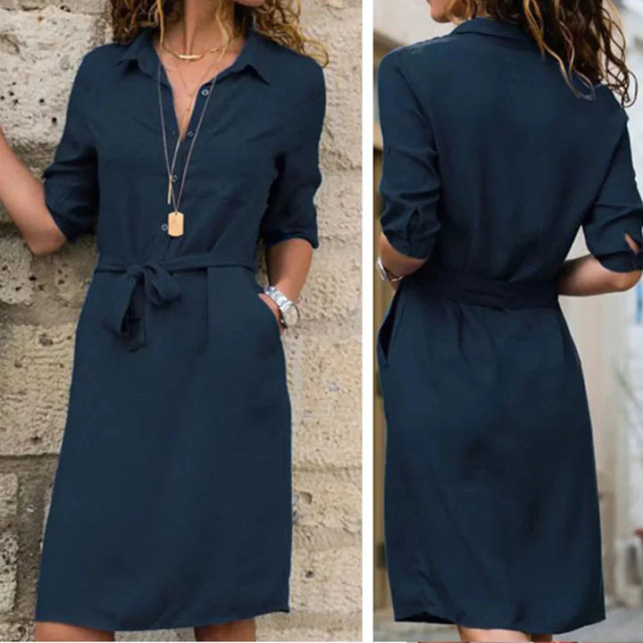 Belted shirt dress in navy blue with a tailored fit, made of lightweight cotton blend fabric, featuring a pointed collar and…
