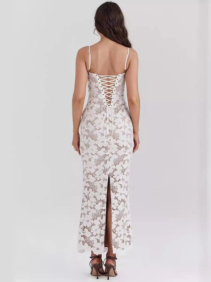 White floral lace spaghetti strap dress with delicate lace detailing and a flowy silhouette for a stylish summer look.