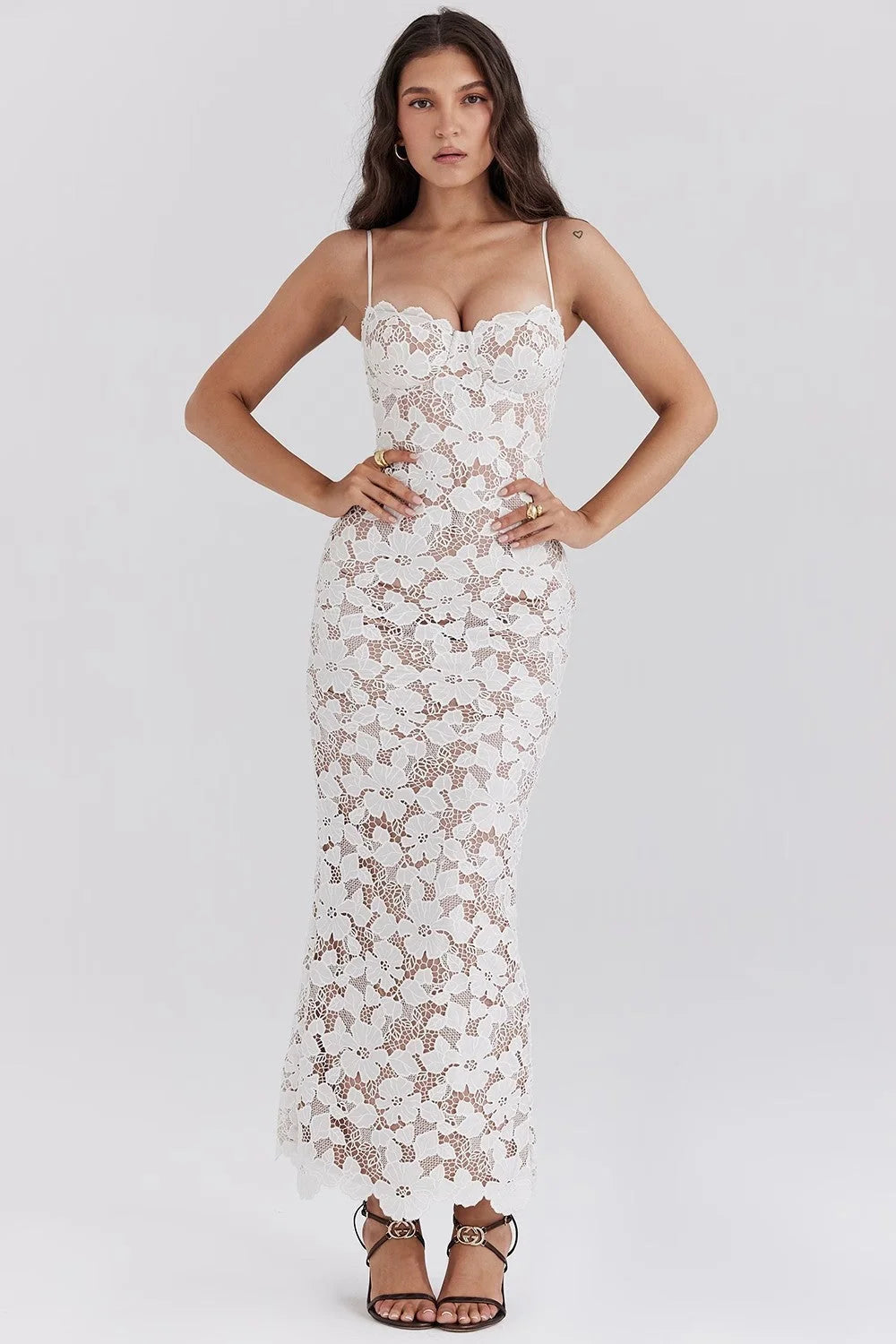 White floral lace spaghetti strap dress with elegant design, perfect for special occasions or summer events.