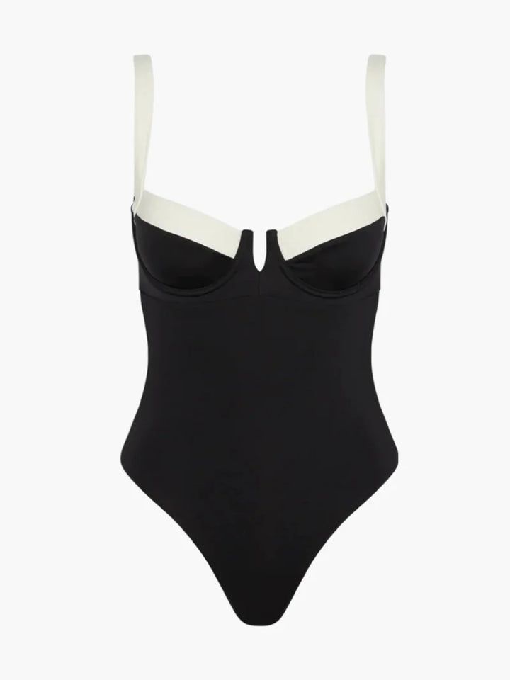 Black and ivory one-piece swimsuit, featuring a stylish color block design with a flattering cut and scoop neckline.