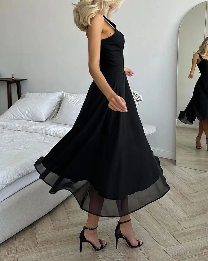 Navy midi dress with square neckline, fitted bodice, and knee-length skirt in lightweight cotton blend fabric.