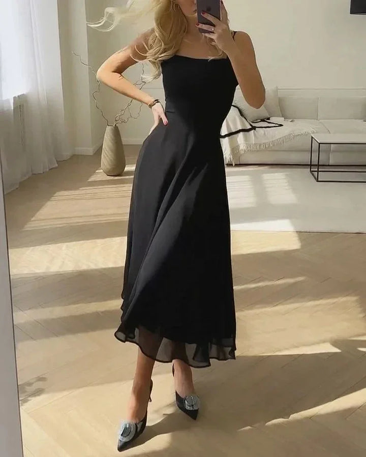 Black square neckline midi dress with fitted bodice. Featuring a textured weave fabric and figure-flattering silhouette.