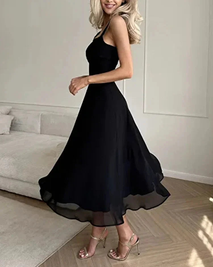 "Evie midi dress in black, square neckline, fitted bodice, perfect for casual or semi-formal events."