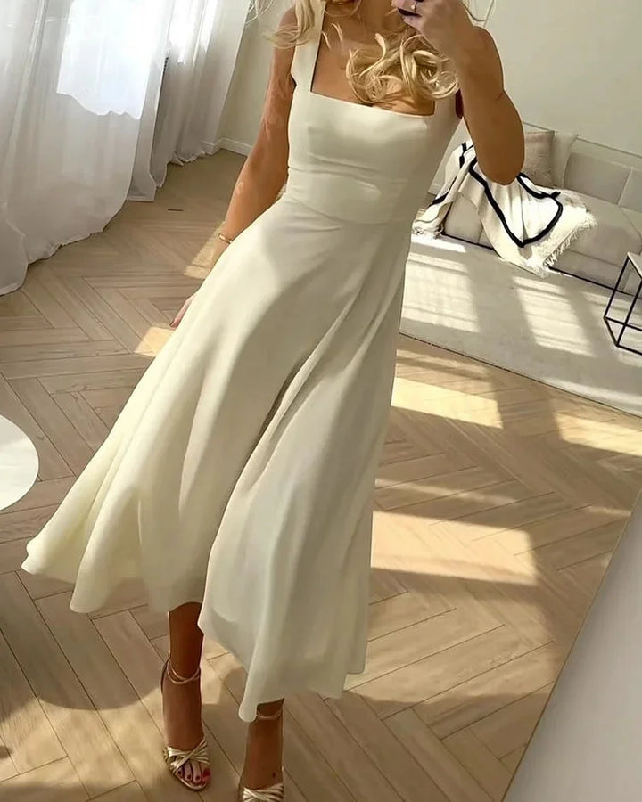 White midi dress with square neckline, fitted bodice. Made from soft cotton blend for a comfortable fit, perfect for a…