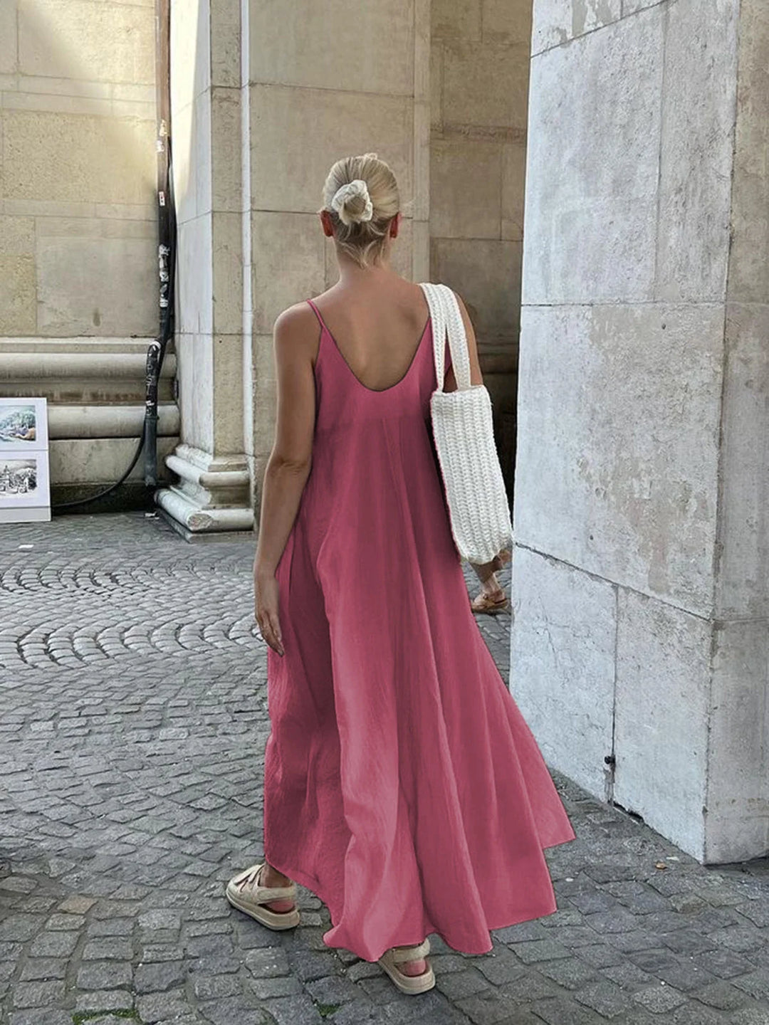 "Flowy layered maxi dress in pale pink with V-neck, perfect for summer days"