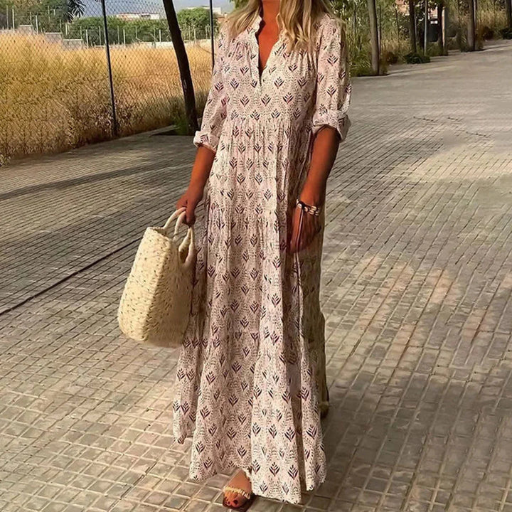 Pink V-neck maxi dress with sleeves by Fatema, featuring a soft and flowy fabric ideal for casual wear or special occasions.