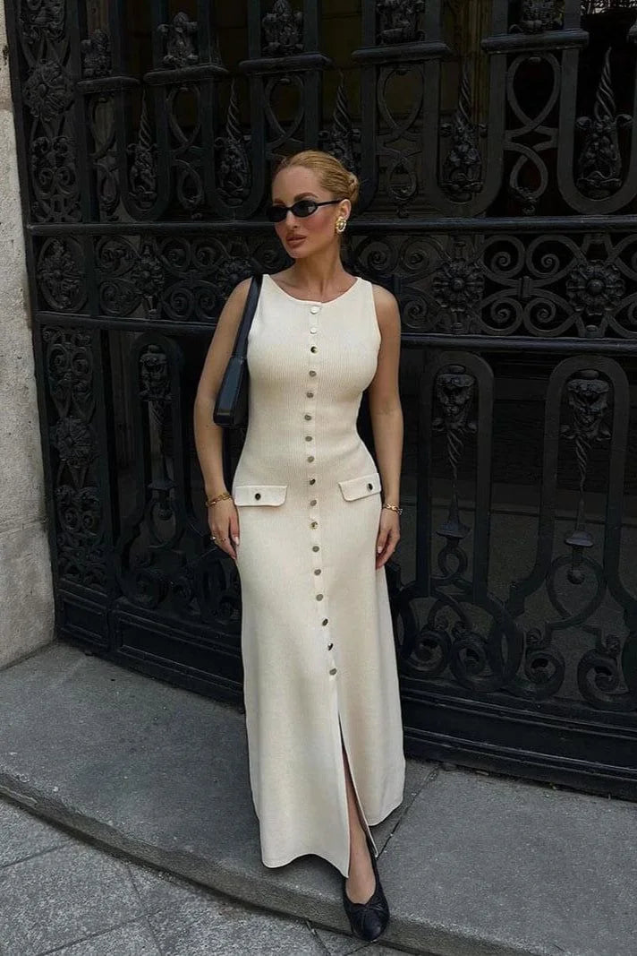 Sleeveless midi dress in a soft linen blend with button-front design and elegant silhouette.
