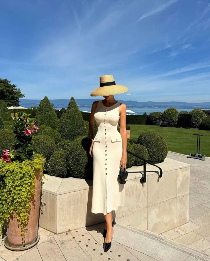 Sleeveless button-front midi dress with a unique design in a comfortable fabric, ideal for casual or formal occasions by…