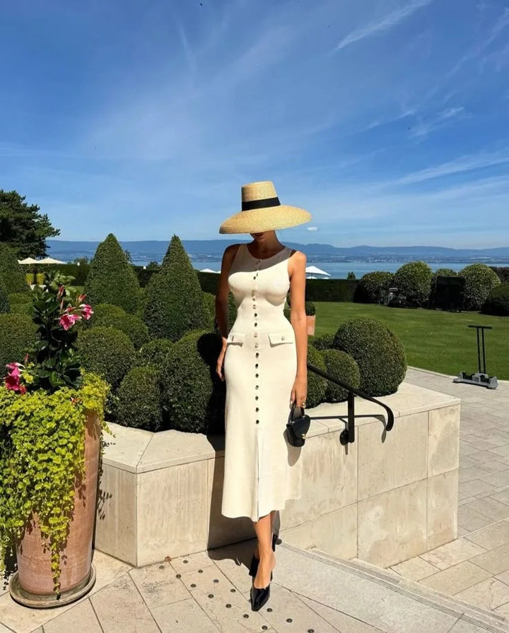 Sleeveless button-front midi dress with a unique design in a comfortable fabric, ideal for casual or formal occasions by…