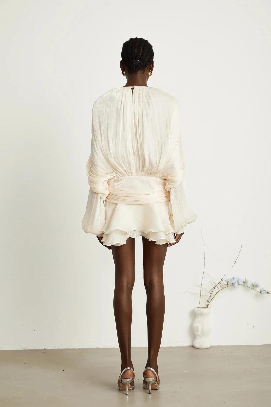 Flowing satin mini dress with tie accents in dusty pink, perfect for a night out or special occasion.