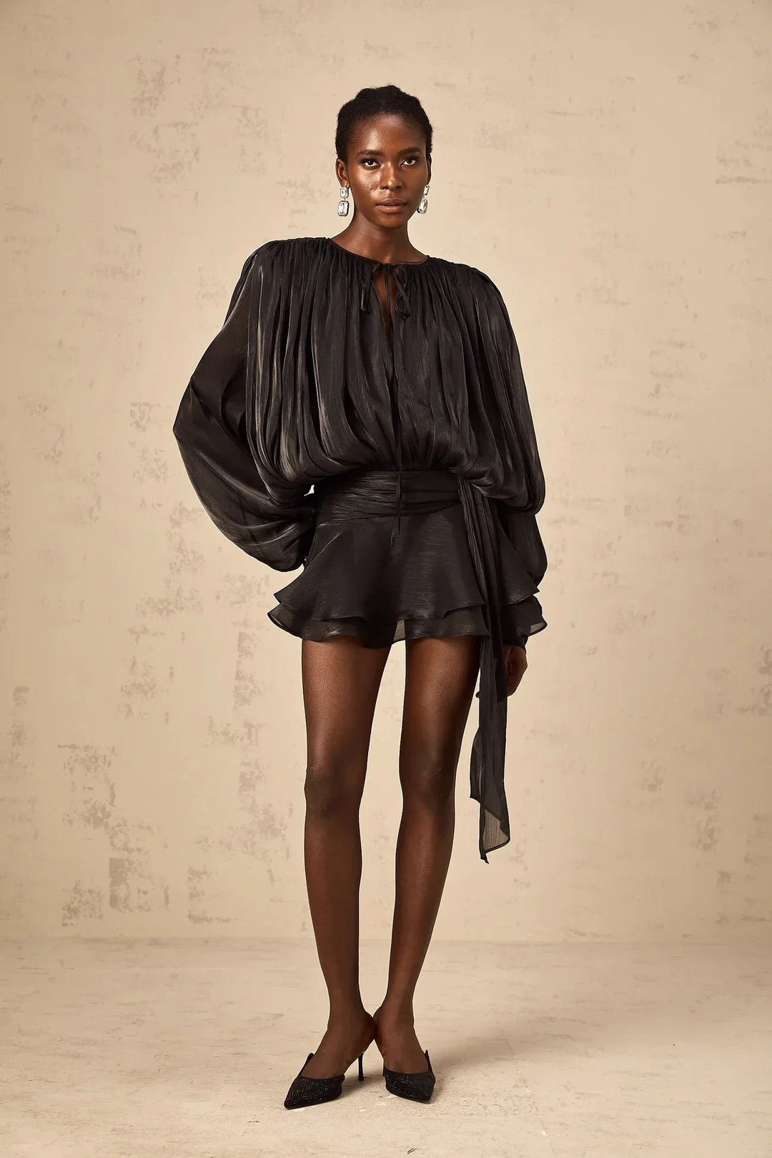 "Gabriella satin mini dress with tie accents in flowing design. Soft and elegant, perfect for any occasion."