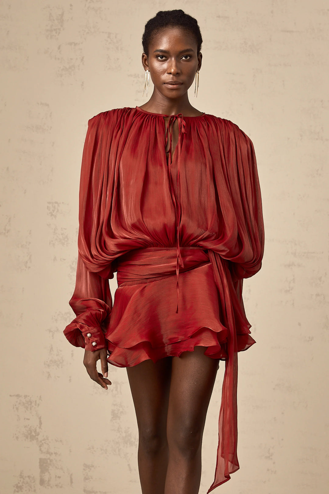 Flowing satin mini dress in Gabriella with tie accents, perfect for a chic and elegant look.