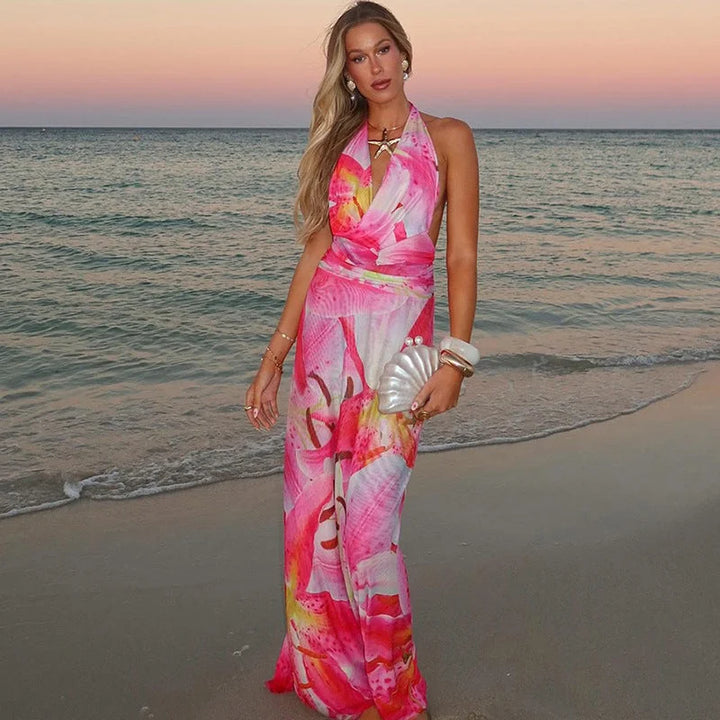 Pink tie-neck backless halter maxi dress in Geneva with a flowy silhouette and intricate tie-neck detail, perfect for summer…
