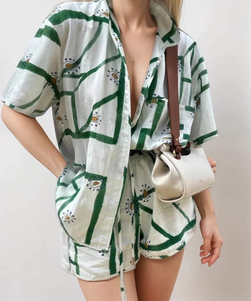 Green and white short sleeve summer set with a comfy printed design. Made from lightweight, breathable material for a…
