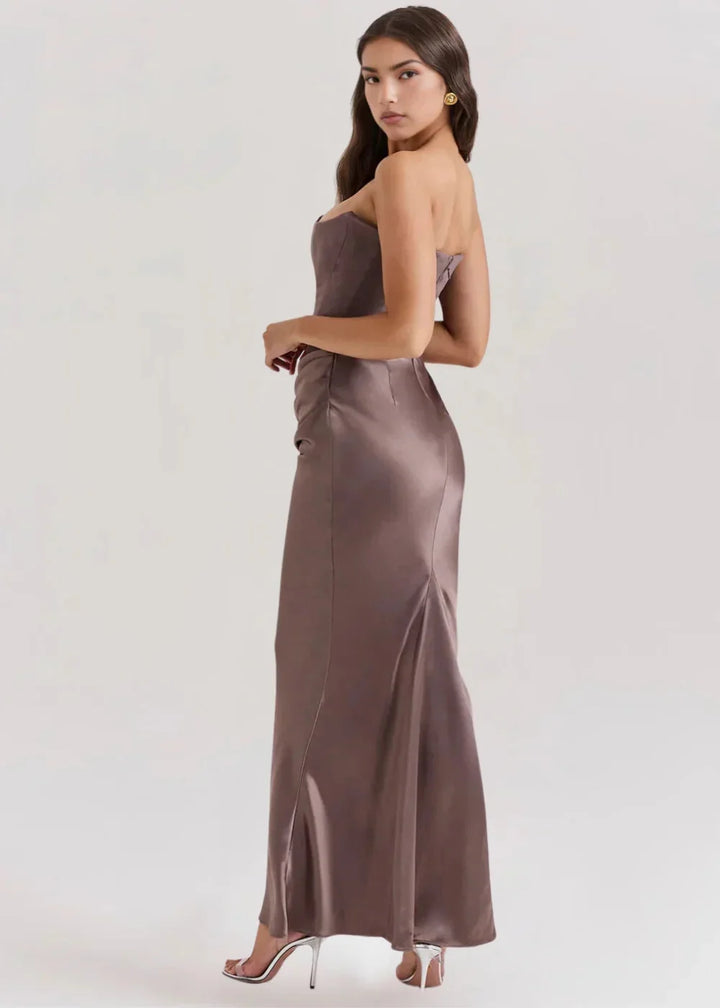 Black strapless evening attire with sleek satin fabric and elegant draped design, perfect for special occasions.