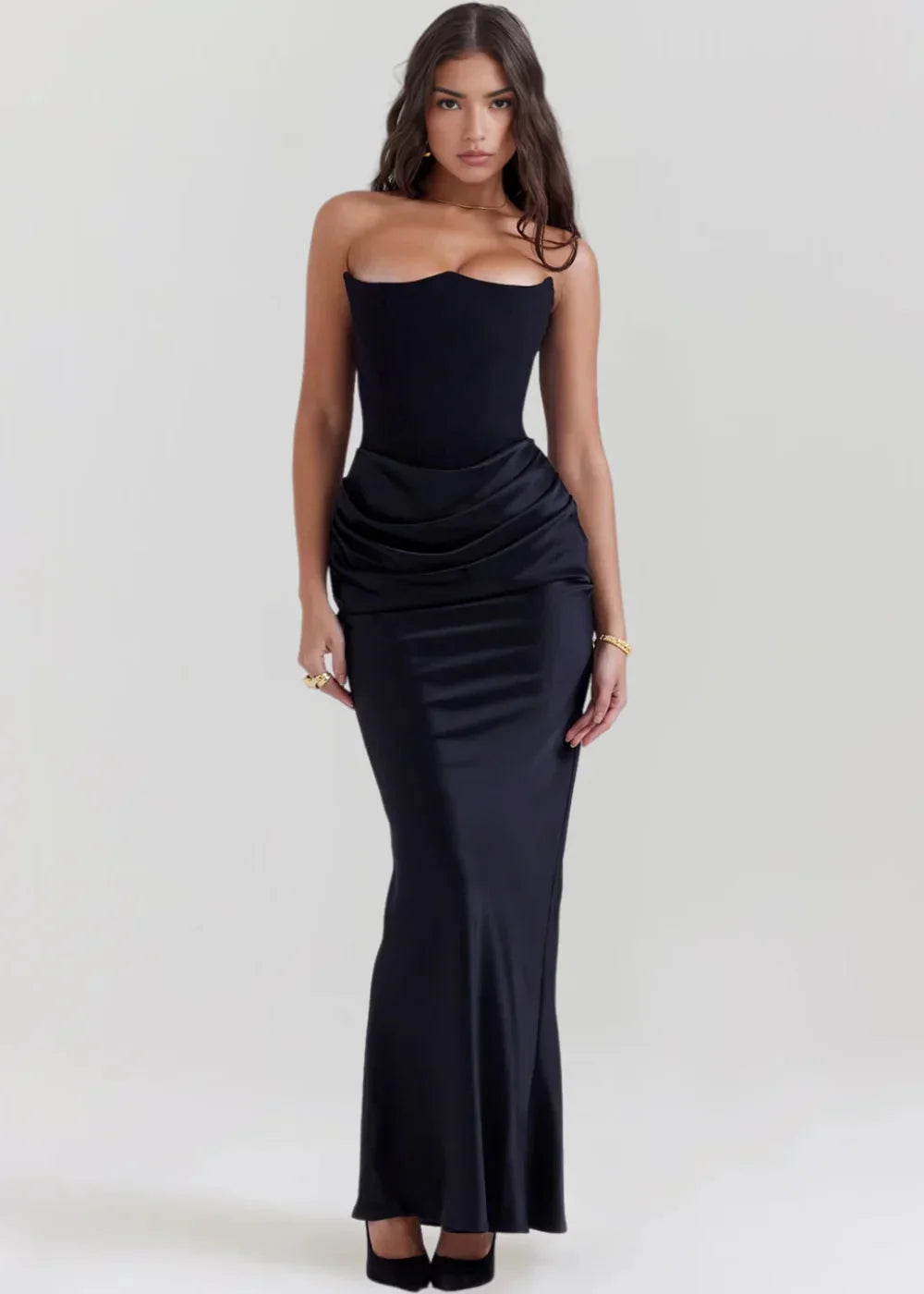 Black strapless evening attire with a sleek and modern design, perfect for formal occasions.